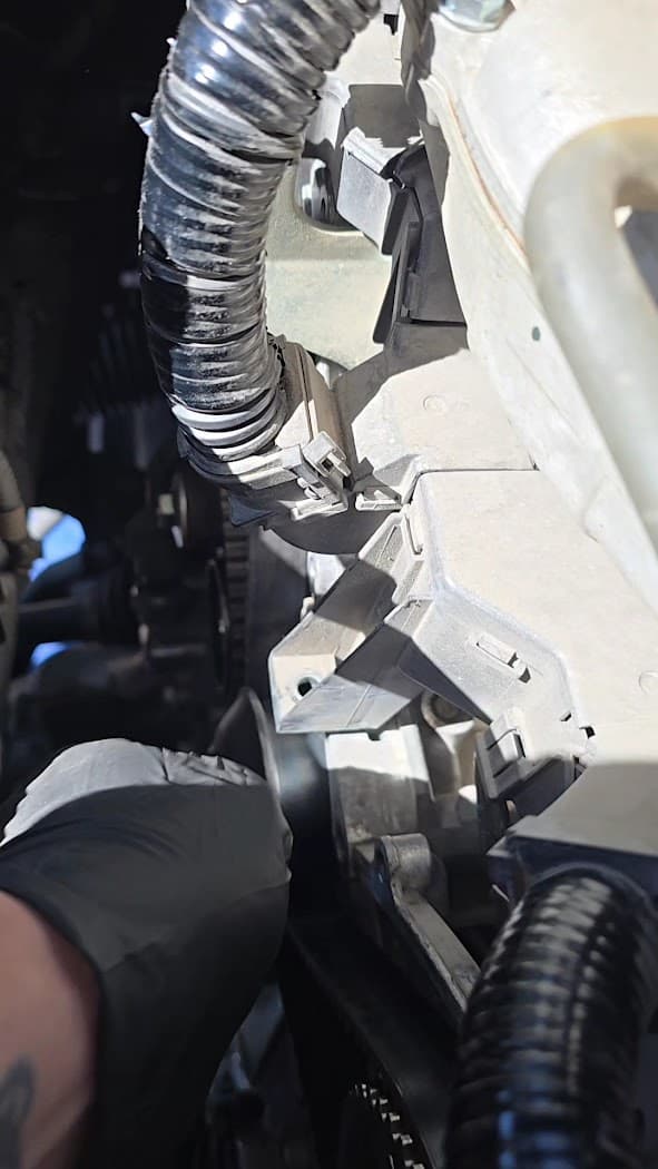 Close up of engine repair work in progress under the hood